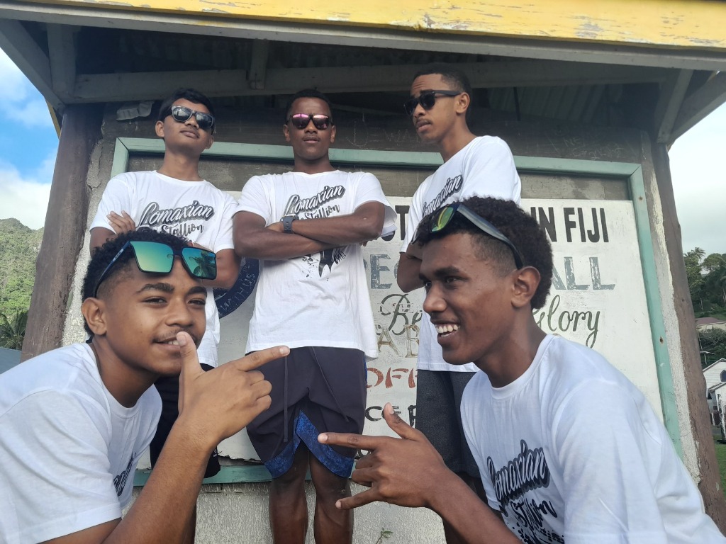 Aryan and friends together in Lomaxian Stallion shirts